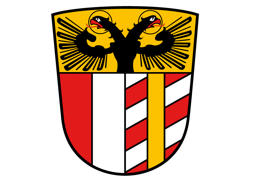 Das Wappen hat die Form eines Schildes, darauf sind abgebildet: oben ein doppelköpfiger Adler auf goldenem Hintergrund; unten links ein roter und weißer Längsbalken; unten rechts je drei schräge weiße und rote Balken, die in der Mitte von einem vertikalen goldenen Balken überlagert werden.