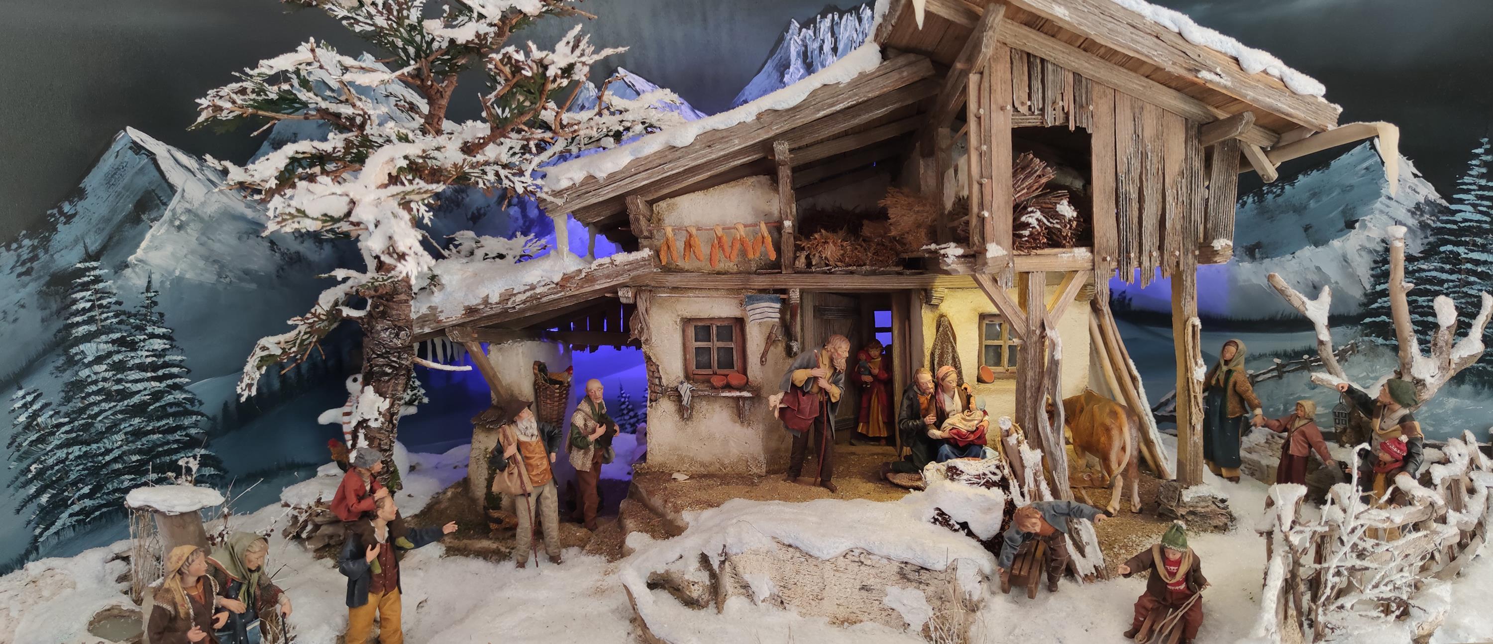 Winterlandschaft mit Stall und Figuren