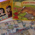 Tisch mit 3 bekannten Brettspielen